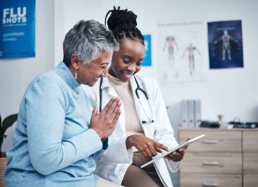 Doctor sharing a document on a clipboard with a patient.