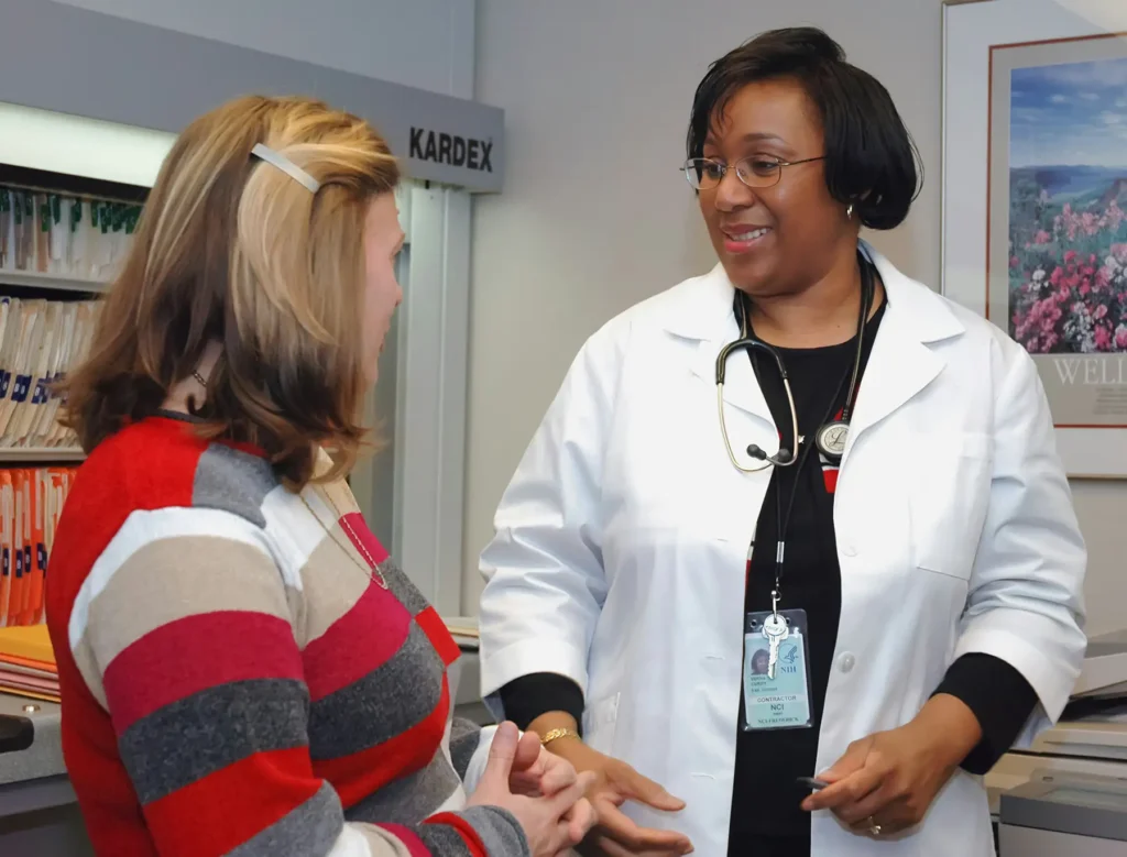 A doctor talking to a female patient.